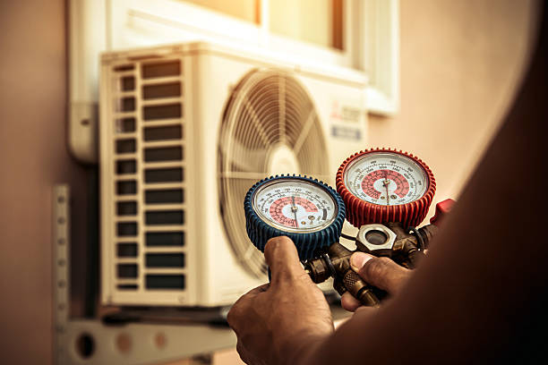 Professional Air Conditioning Service technician working in Dewitt, IL
